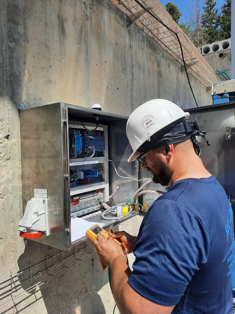 AltoService company owner working on electrical equipment