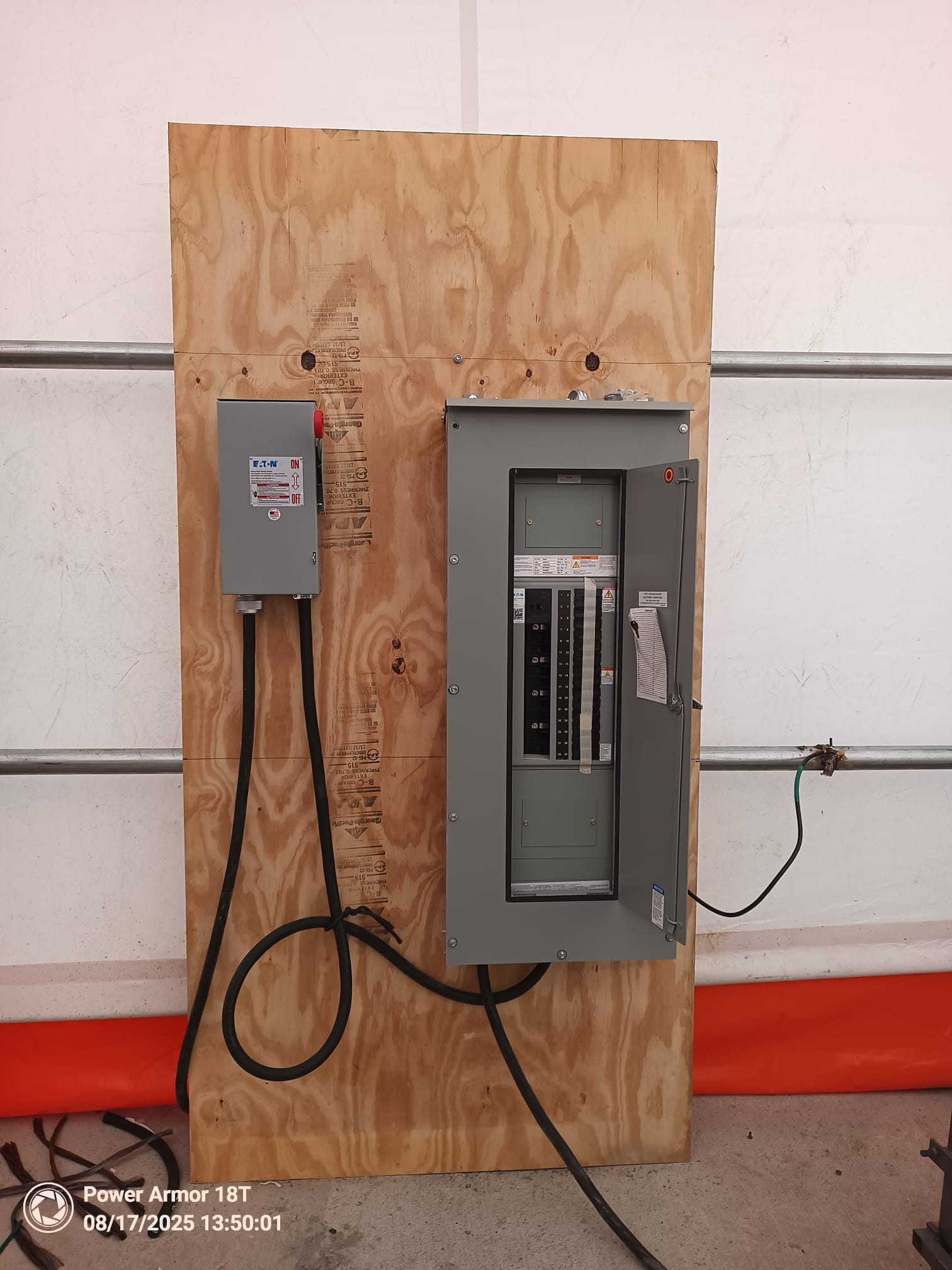 Eaton disconnect and distribution panel mounted on plywood with connected wiring