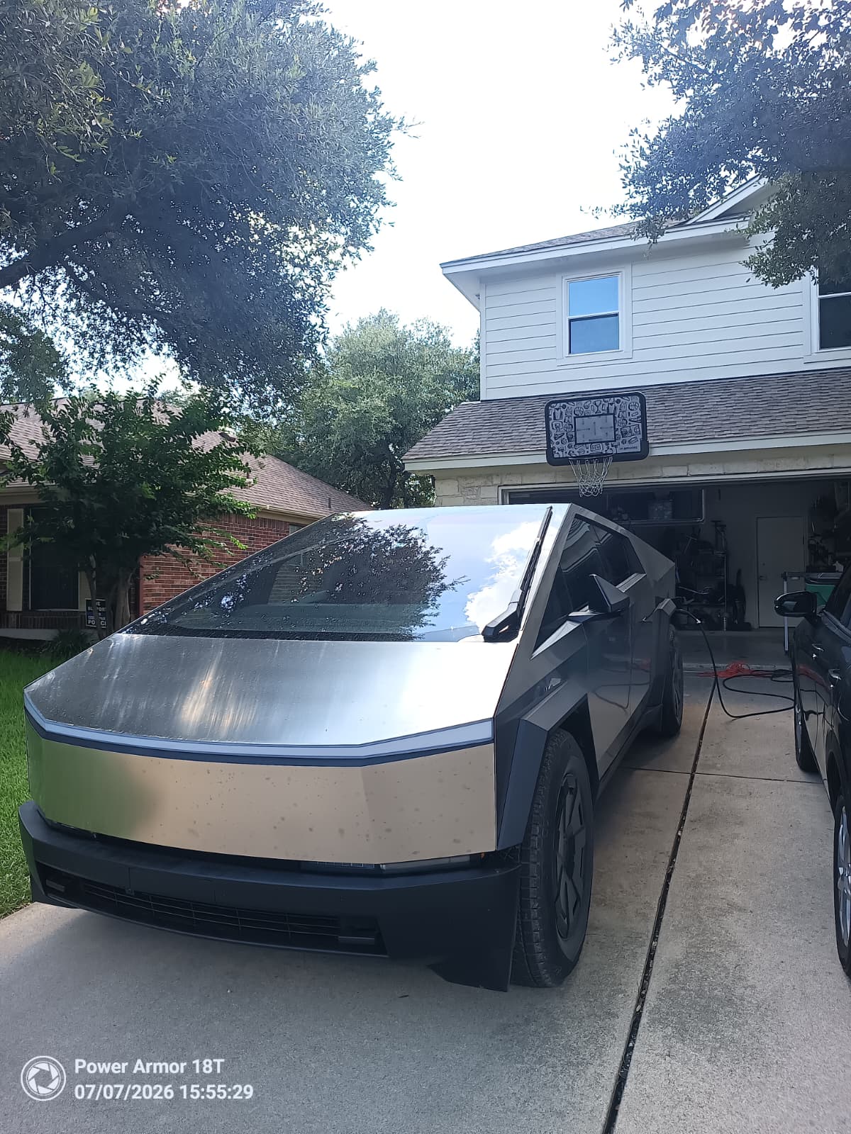 Cybertruck connected at a home driveway